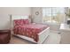 Bright bedroom with white plantation shutters, neutral walls and a comfortable bed at 9531 Desert Willow Way, Highlands Ranch, CO 80129