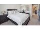 Bedroom features a bed, carpeted floors, and mirrored closet with neutral walls and furnishings at 9531 Desert Willow Way, Highlands Ranch, CO 80129