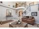 Welcoming foyer with a staircase, wrought iron railings, and neutral decor, creating a sophisticated entrance at 9531 Desert Willow Way, Highlands Ranch, CO 80129