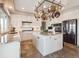 Updated kitchen with stainless appliances, granite countertops, white cabinets, and tile flooring at 9531 Desert Willow Way, Highlands Ranch, CO 80129