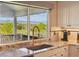 Kitchen sink with a view of the mountains at 9531 Desert Willow Way, Highlands Ranch, CO 80129