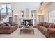 Inviting living room featuring a fireplace, vaulted ceilings, and comfortable seating, creating a cozy atmosphere at 9531 Desert Willow Way, Highlands Ranch, CO 80129