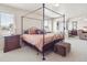 Spacious main bedroom with a four poster bed, sitting area, and great natural light at 9531 Desert Willow Way, Highlands Ranch, CO 80129