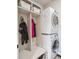Convenient mudroom with stacked laundry and built-in storage for coats and gear at 9531 Desert Willow Way, Highlands Ranch, CO 80129