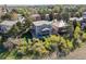 Aerial view of the home's rear exterior with a spacious yard and a deck for outdoor living at 9531 Desert Willow Way, Highlands Ranch, CO 80129