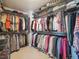 Organized walk-in closet with metal shelving for clothing storage and shoes at 9531 Desert Willow Way, Highlands Ranch, CO 80129