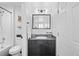 Stylish bathroom features a sleek black vanity, granite countertop, mirrored medicine cabinet, and tub with shower at 970 S Dawson Way # 9, Aurora, CO 80012