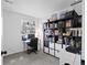 Home office or bedroom with large bookcase, desk, and plants at 970 S Dawson Way # 9, Aurora, CO 80012