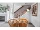 Light-filled dining area with wood table, staircase, and stylish decor at 970 S Dawson Way # 9, Aurora, CO 80012