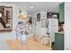 Inviting dining area featuring wood table and chairs, open to the kitchen at 970 S Dawson Way # 9, Aurora, CO 80012