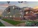 Multi-story residential building features balconies, brick accents, and manicured lawn at 970 S Dawson Way # 9, Aurora, CO 80012