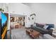Spacious living room with open layout, connecting to the dining area and kitchen at 970 S Dawson Way # 9, Aurora, CO 80012