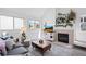 Cozy living room with fireplace, large windows, and comfortable gray sofa at 970 S Dawson Way # 9, Aurora, CO 80012