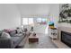 Inviting living room features fireplace, modern decor, and comfortable gray sofa at 970 S Dawson Way # 9, Aurora, CO 80012
