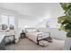 Bright main bedroom with a bed, vanity, and large open space, creating a comfortable retreat at 970 S Dawson Way # 9, Aurora, CO 80012