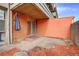 Enclosed back patio, featuring brick siding, a covered porch and shade umbrella at 2500 S York St # 115, Denver, CO 80210