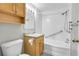 Bathroom featuring tub, shower, and vanity at 2500 S York St # 115, Denver, CO 80210