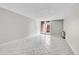 Bright living area with tile floors and a sliding glass door to the outside at 2500 S York St # 115, Denver, CO 80210