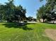 Beautiful park with mature trees, picnic tables, basketball courts and green grass at 2500 S York St # 115, Denver, CO 80210