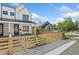 Stylish modern farmhouse with a fenced front yard and a charming outdoor seating area at 2426 Ames St, Edgewater, CO 80214