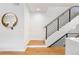 Modern staircase with metal railing and hardwood flooring at 2426 Ames St, Edgewater, CO 80214