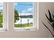 Large window shows a lovely view of a local lakefront park with walking trail at 2426 Ames St, Edgewater, CO 80214