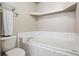 Bathroom featuring a soaking tub with tile surround, a tiled floor and a modern towel rack at 11100 Callaway Ct, Parker, CO 80138