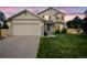 Exterior shot of a two-story home with a well-manicured lawn and a two-car garage at 11100 Callaway Ct, Parker, CO 80138