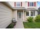 Front entrance of the home featuring a lovely fountain, fresh landscaping, and classic red window shutters at 11100 Callaway Ct, Parker, CO 80138