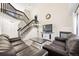 The living room with a vaulted ceiling, fireplace, wood floors and staircase at 11100 Callaway Ct, Parker, CO 80138