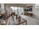 Comfortable living room with stylish decor, large windows, and access to the balcony at 10307 Vaughn Way, Commerce City, CO 80022