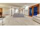 Finished basement with seating, access to the patio, and neutral-colored walls and carpets providing a modern look at 2597 Oak Vista Ct, Castle Rock, CO 80104