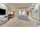 Basement area boasts a TV, bar seating, and a comfortable seating area for relaxing and entertaining guests at 2597 Oak Vista Ct, Castle Rock, CO 80104
