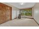 Bedroom with large windows, neutral carpet and an accent chair at 2597 Oak Vista Ct, Castle Rock, CO 80104