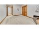 Hallway with hardwood flooring, wooden doors, and baseboards leading to additional living spaces and bedrooms at 2597 Oak Vista Ct, Castle Rock, CO 80104