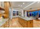 Open floor plan kitchen with hardwood floors, granite counters, and stainless steel appliances at 2597 Oak Vista Ct, Castle Rock, CO 80104
