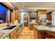 Modern kitchen with stainless appliances, granite countertops, and custom wood cabinetry at 2597 Oak Vista Ct, Castle Rock, CO 80104