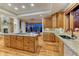 Bright kitchen with granite counters, stainless steel appliances, and hardwood floors at 2597 Oak Vista Ct, Castle Rock, CO 80104