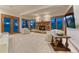 Welcoming living room features a stone fireplace, plenty of natural light, and comfortable seating at 2597 Oak Vista Ct, Castle Rock, CO 80104