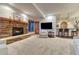 Finished basement has stone fireplace, wet bar, and large TV at 2597 Oak Vista Ct, Castle Rock, CO 80104