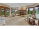 Inviting living room features a stone fireplace, plush seating, and abundant natural light at 2597 Oak Vista Ct, Castle Rock, CO 80104