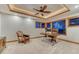 Bright office features a tray ceiling, ceiling fan, and large windows creating an ideal work environment at 2597 Oak Vista Ct, Castle Rock, CO 80104