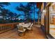 Relaxing outdoor patio with a dining set offers a serene space for enjoying meals and fresh air at 2597 Oak Vista Ct, Castle Rock, CO 80104