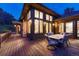 Charming patio features a dining set, ideal for gatherings, and showcases the home's beautiful architectural details at 2597 Oak Vista Ct, Castle Rock, CO 80104