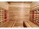 Indoor sauna with wood paneling and benches at 2597 Oak Vista Ct, Castle Rock, CO 80104