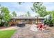 Spacious backyard featuring a hot tub, fire pit, and outdoor seating at 7579 Jay Ct, Arvada, CO 80003