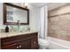 Updated bathroom featuring custom vanity and stylish tile work at 7579 Jay Ct, Arvada, CO 80003