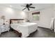 Serene bedroom featuring a ceiling fan and large windows at 7579 Jay Ct, Arvada, CO 80003