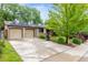 Inviting home with a long driveway and attached two-car garage, plus solar panels at 7579 Jay Ct, Arvada, CO 80003
