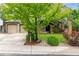 Charming home featuring a well-maintained lawn, mature landscaping, and a classic exterior at 7579 Jay Ct, Arvada, CO 80003